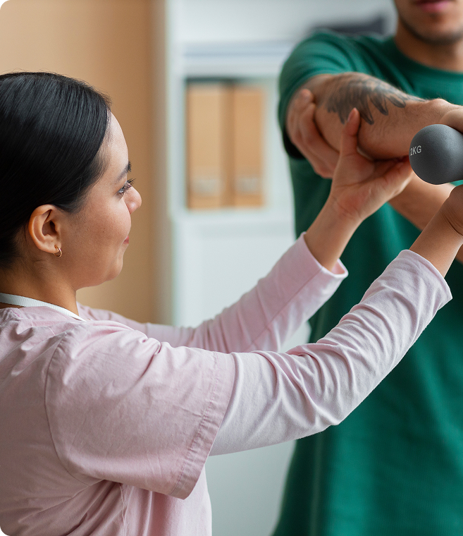 doctor-helping-patient-rehabilitation